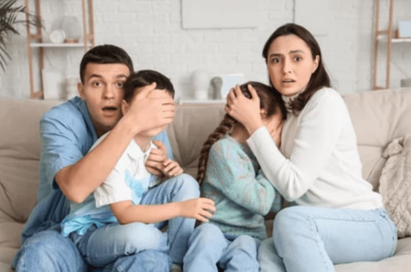 Shocked Parents Shield Kids From the Screen — Reaction Stock Photo meme