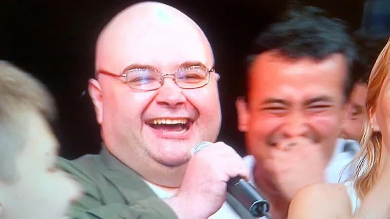 Bald Guy Laughing With Microphone — Reaction meme