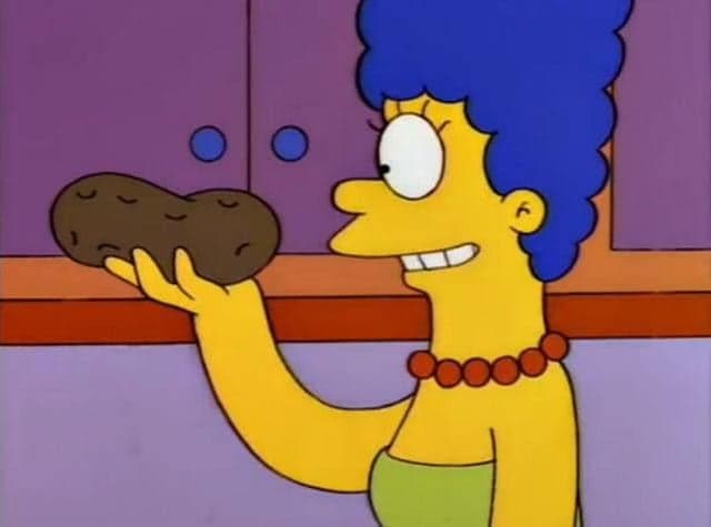 Marge Simpson Smiles While Holding A Potato — Simpsons meme